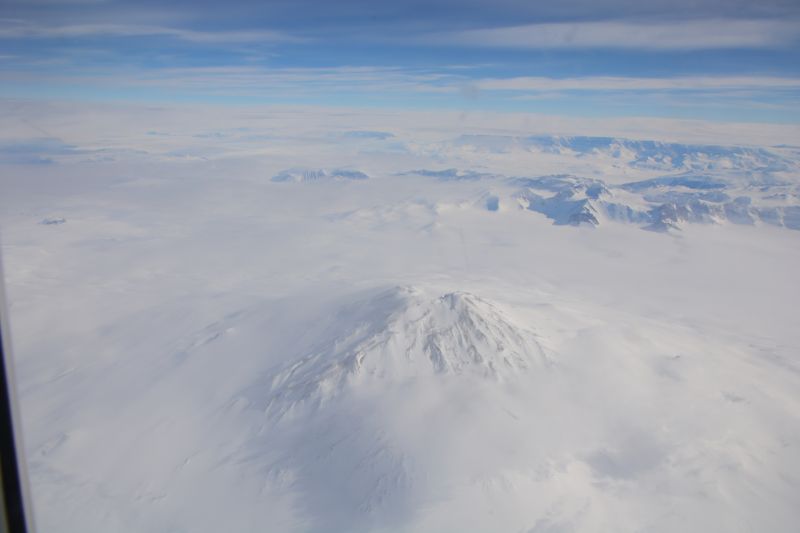 View of a volcano from an aeroplane window