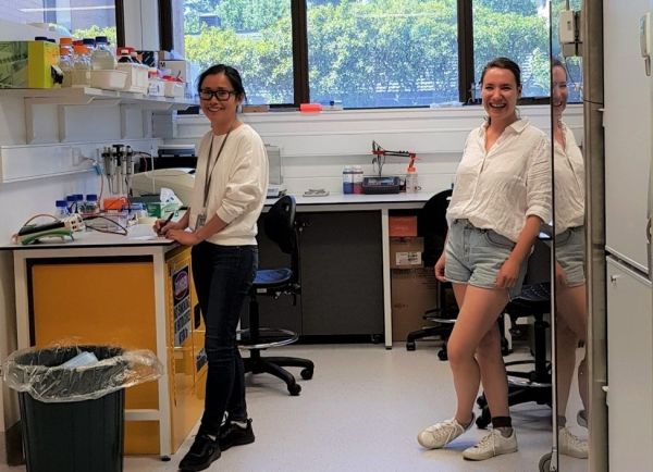 Two researchers standing in a lab.