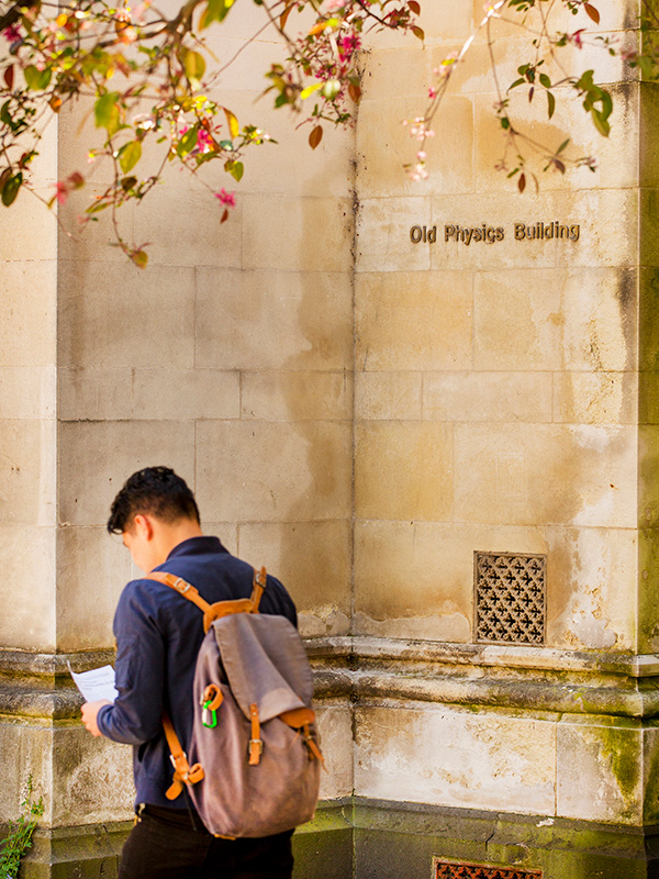 Student walking past the Old Physics Building