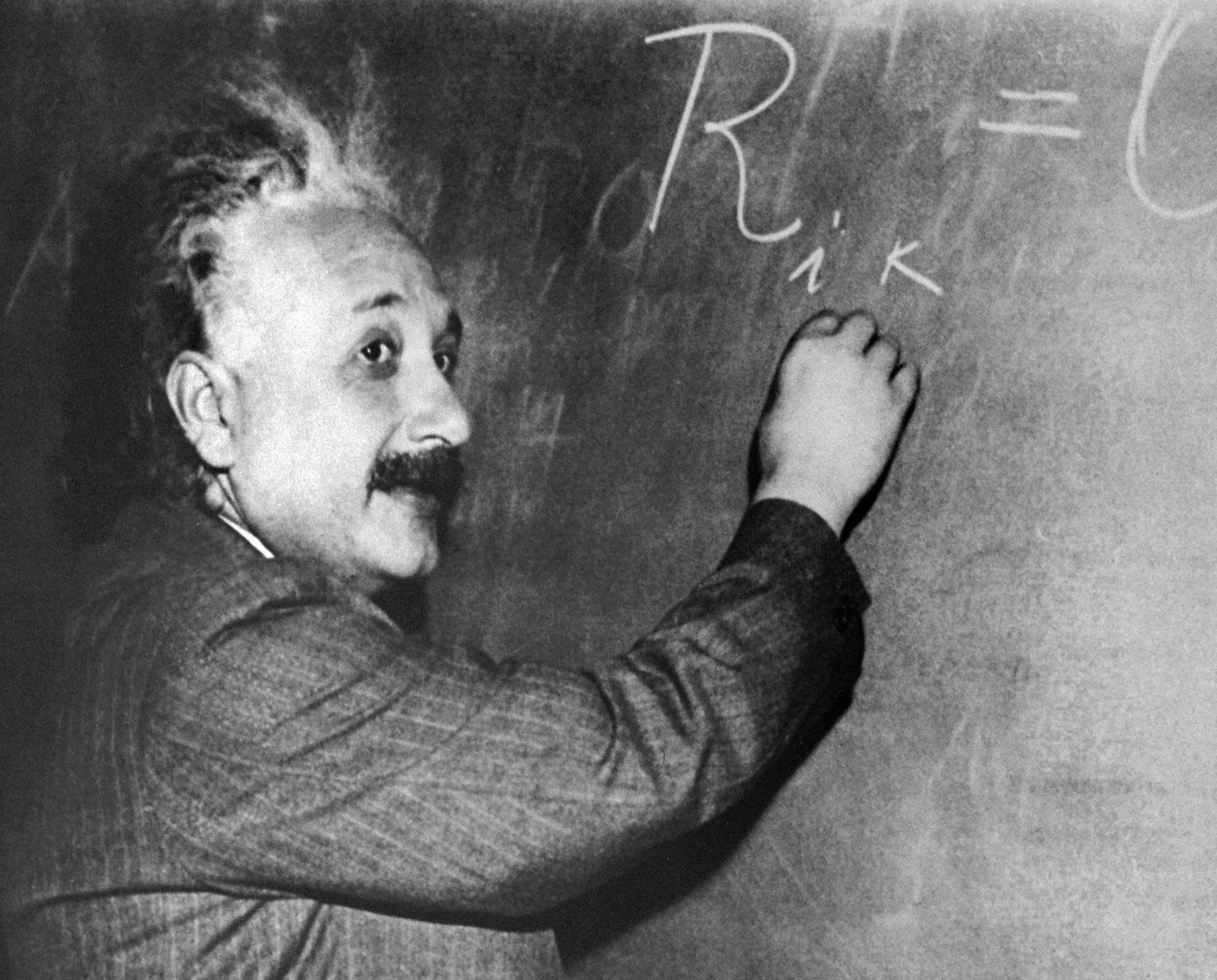 Albert Einstein at a chalk board.